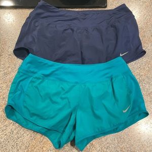 Two pairs of Nike running shorts
